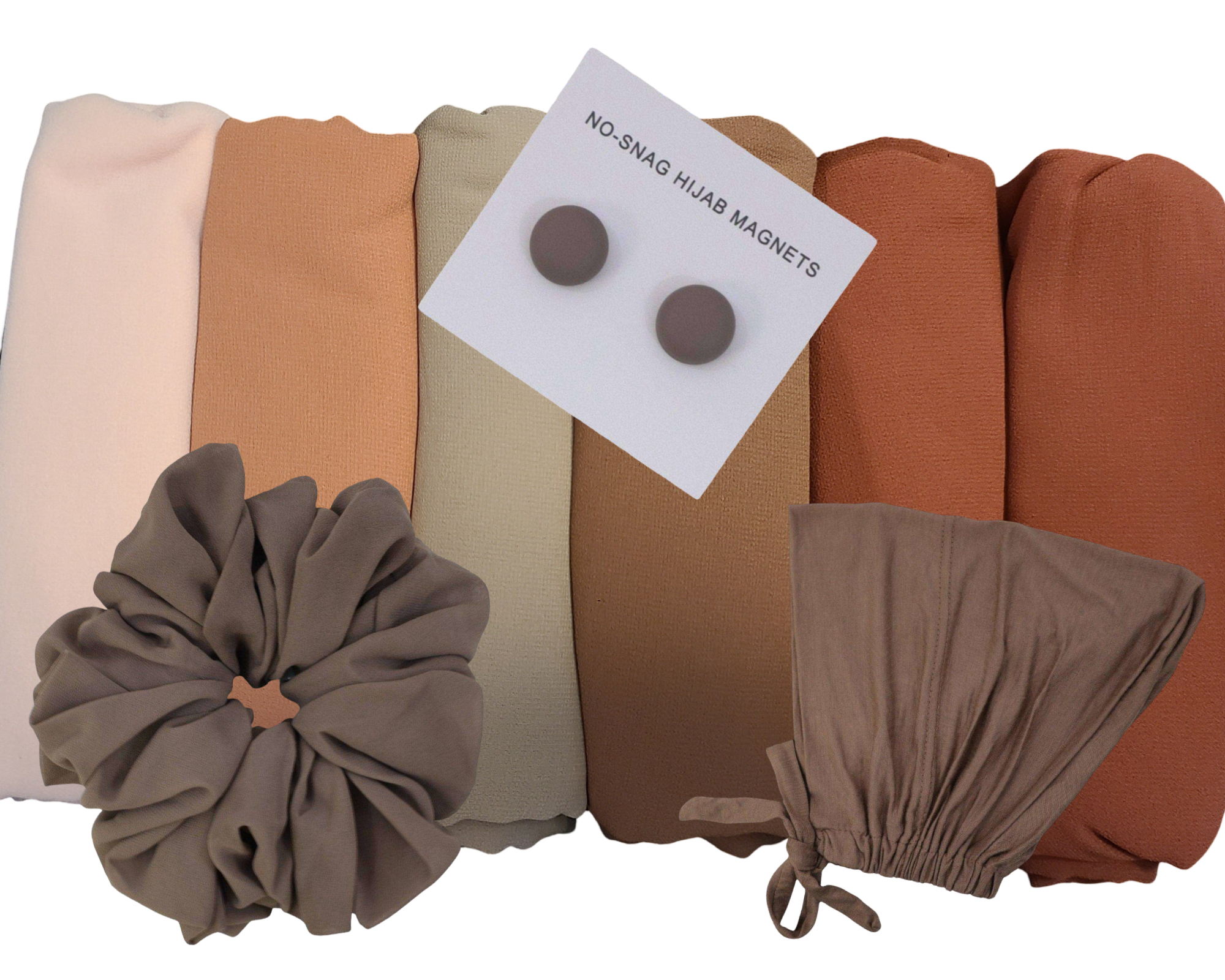 Flat lay of chiffon hijab set with six colors and coordinated accessories including undercaps, scrunchies, and magnets